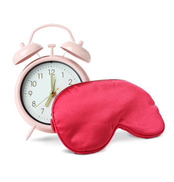 Photo sleep mask and alarm clock isolated on white