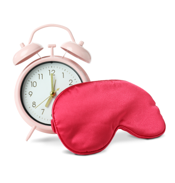 Photo sleep mask and alarm clock isolated on white